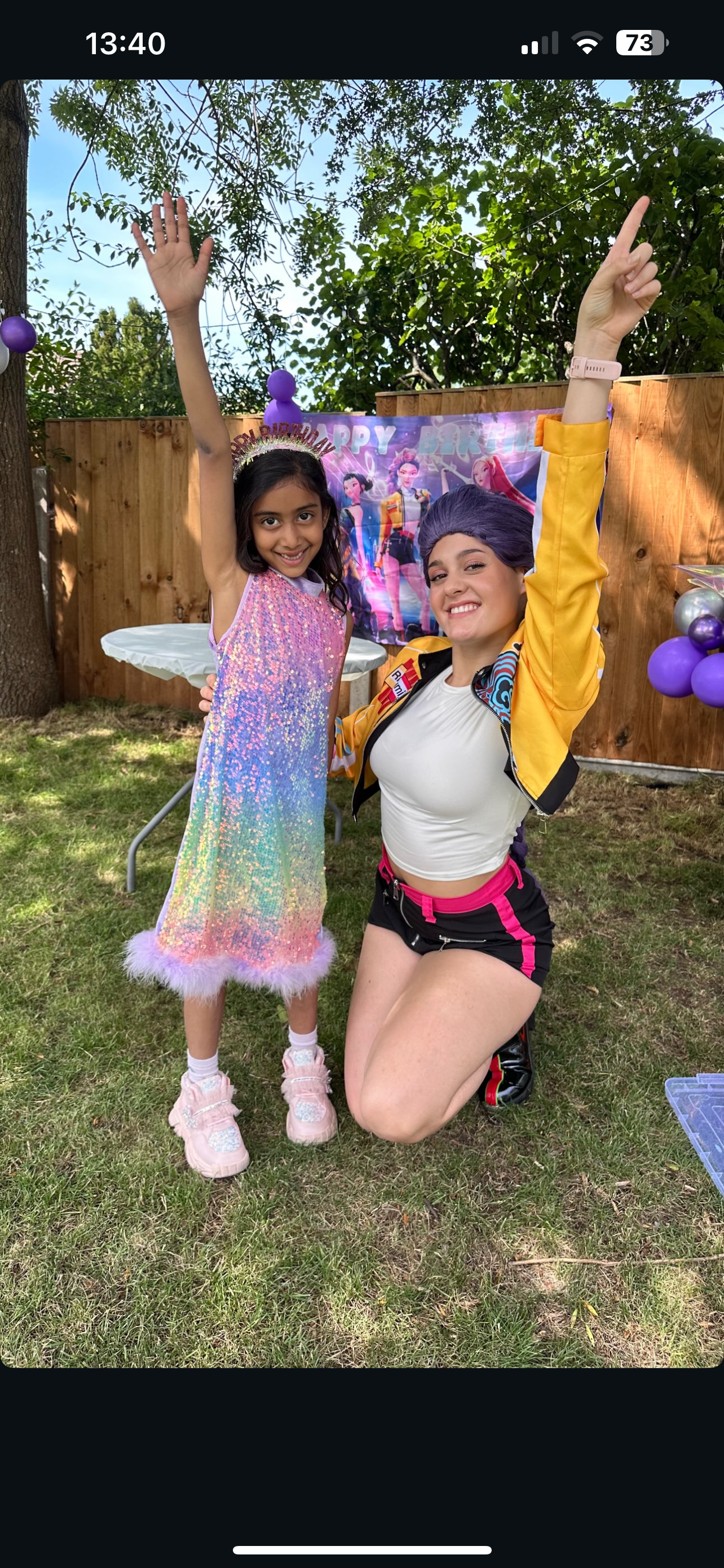 Outdoor party with rainbow sequin dress character